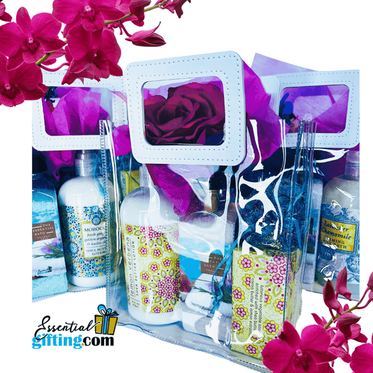 Colorful bath and body products in a tote bag gift set, including bottles, brushes, and vibrant floral accents