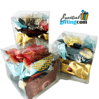 Thumbnail for Assorted candy cubes in gift boxes with the Essentialgifting.com logo displayed.
