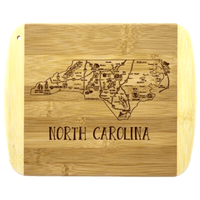 Thumbnail for Rustic North Carolina-themed bamboo cutting board with engraved state map and text.