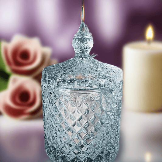 Elegant crystal candle holder surrounded by delicate white flowers.
