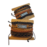 Thumbnail for Stack of braided bracelets with 'believe' tag on a white background
