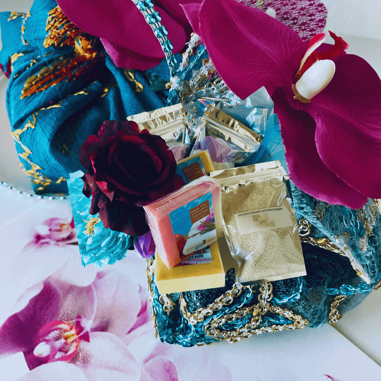 Vibrant artisan handcrafted bar soaps with floral elements, wrapped in a decorative box.