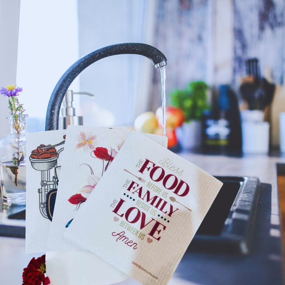 Kitchen scene with a dishcloth featuring a quote about food, family, and love.