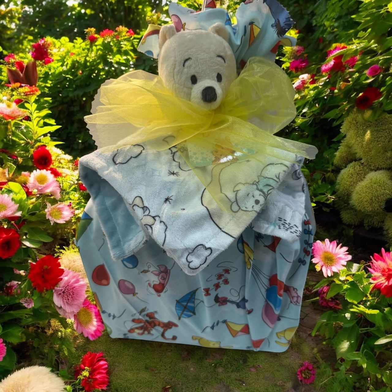 baby gift basket with blanket and plush toy