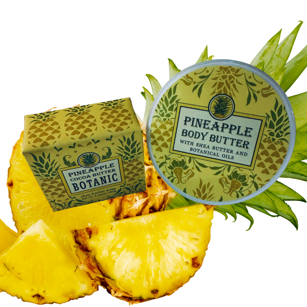 Pineapple-themed body butter and soap with a pineapple slice on a white background