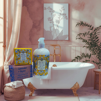 Thumbnail for Bathroom setting with Sicily soap and bath products on a white bathtub.