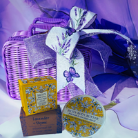 Thumbnail for Lavender and yellow Sicily-themed gift set featuring a purple wicker basket tied with a lavender ribbon, a yellow Sicily body butter tin, and a brown box of lavender + thyme essential oil soap.