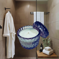 Thumbnail for Bathroom setting with a large blue candle in the foreground
