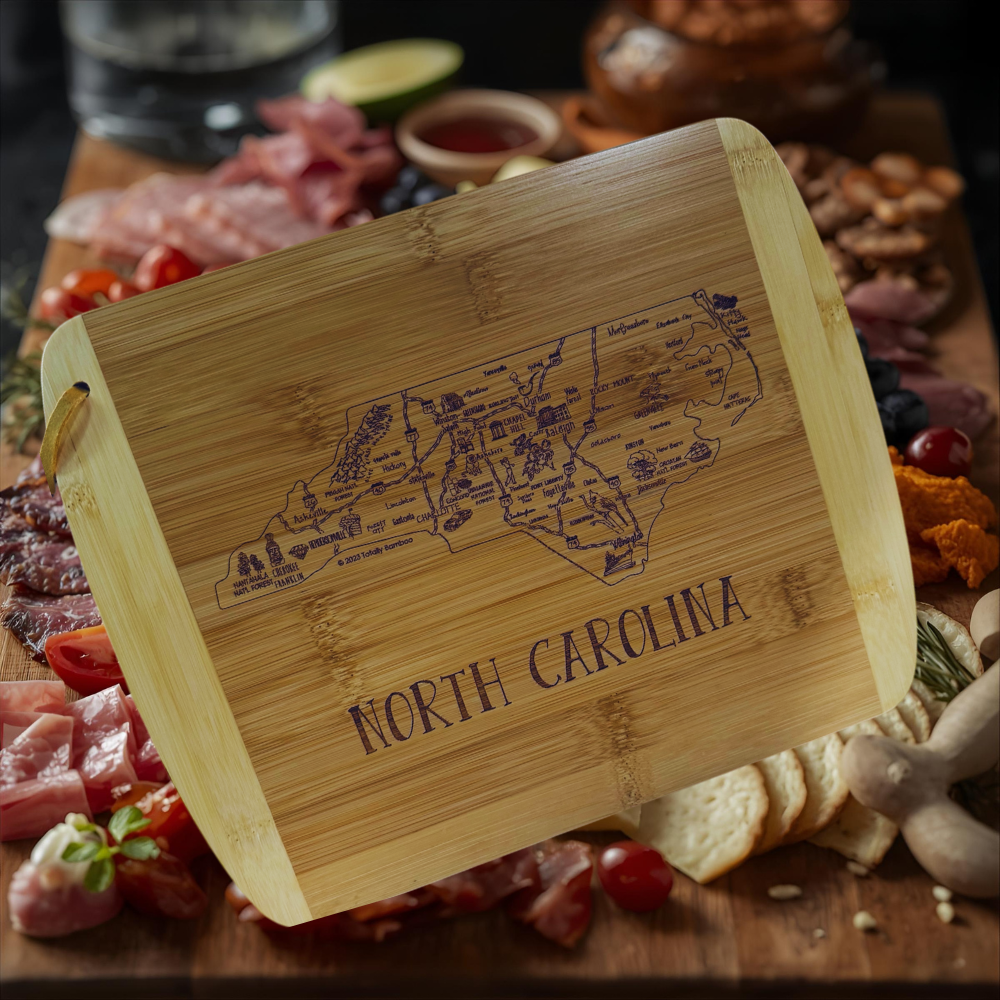 Bamboo cutting board with 'North Carolina' engraving on a charcuterie board.