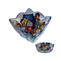 Thumbnail for Clear glass bowl filled with Ferrero Rocher chocolates on a white background