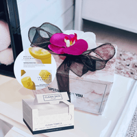 Thumbnail for Stylish skin care essentials in a clean, sophisticated gift box with a vibrant floral accent, offering a luxurious pampering experience.