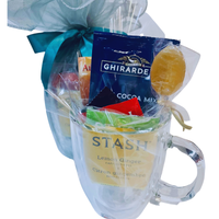 Thumbnail for Clear mug with lemon ginger tea, Ghirarde cocoa mix, and other items on a white background