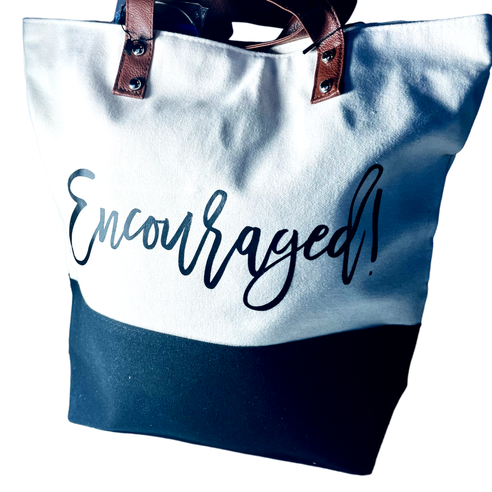 Tote bag with 'Encouraged!' text on a white background
