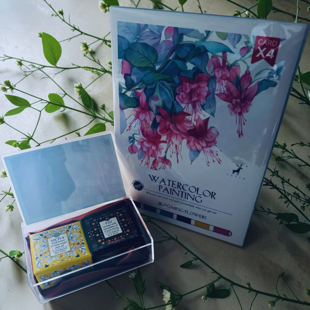 Packaging of watercolor painting cards with floral design on a floral background