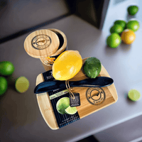 Thumbnail for Wooden bar cutting board with citrus slices and limes, essential kitchen accessories for North Carolina gifts.