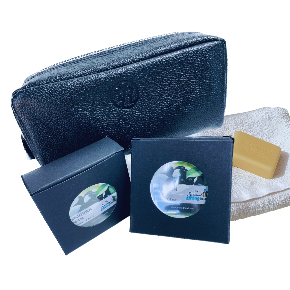 Black leather pouch with two soap boxes and a bar of soap on a white background
