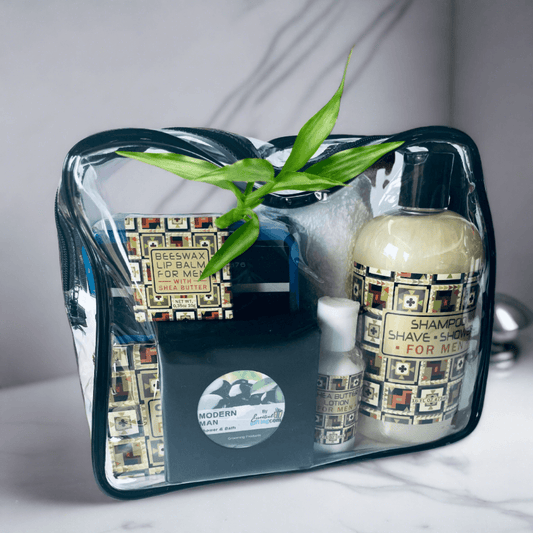 Stylish men's grooming set with sleek glass bottles and lush green foliage accents, offering a premium personal care experience.