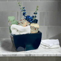 Thumbnail for Elegant men's toiletry set with blue flowers, towels, and grooming products displayed on a marble surface.