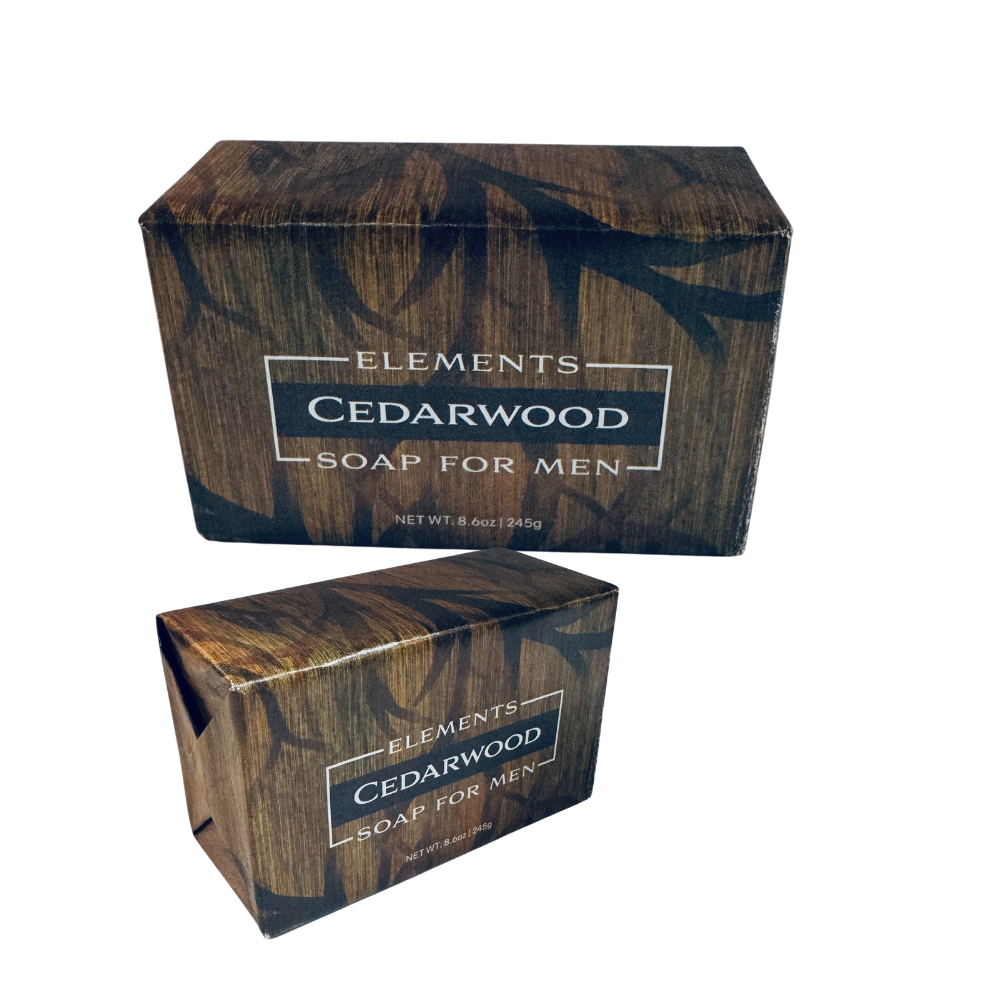 Two rectangular bars of Elements Cedarwood Soap for Men in matching dark brown wood-grain packaging, shown on a plain white background.
