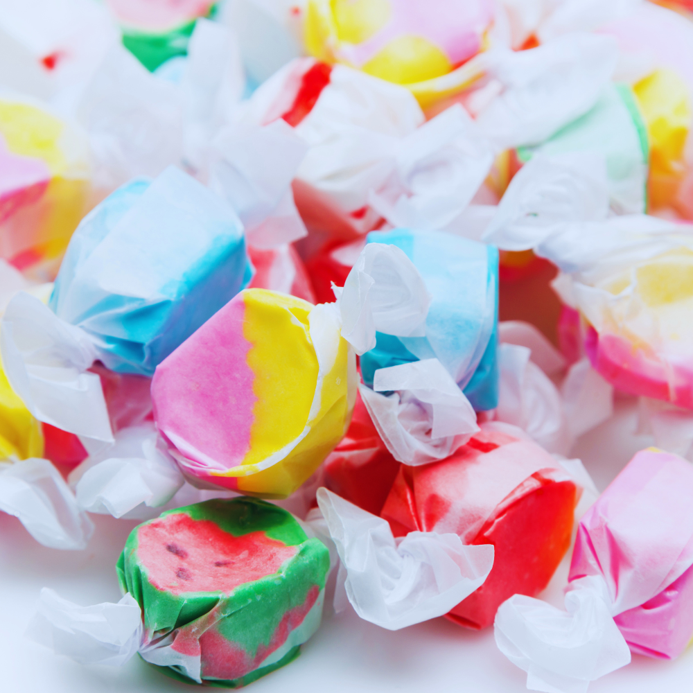 Colorful taffy candies on a white background