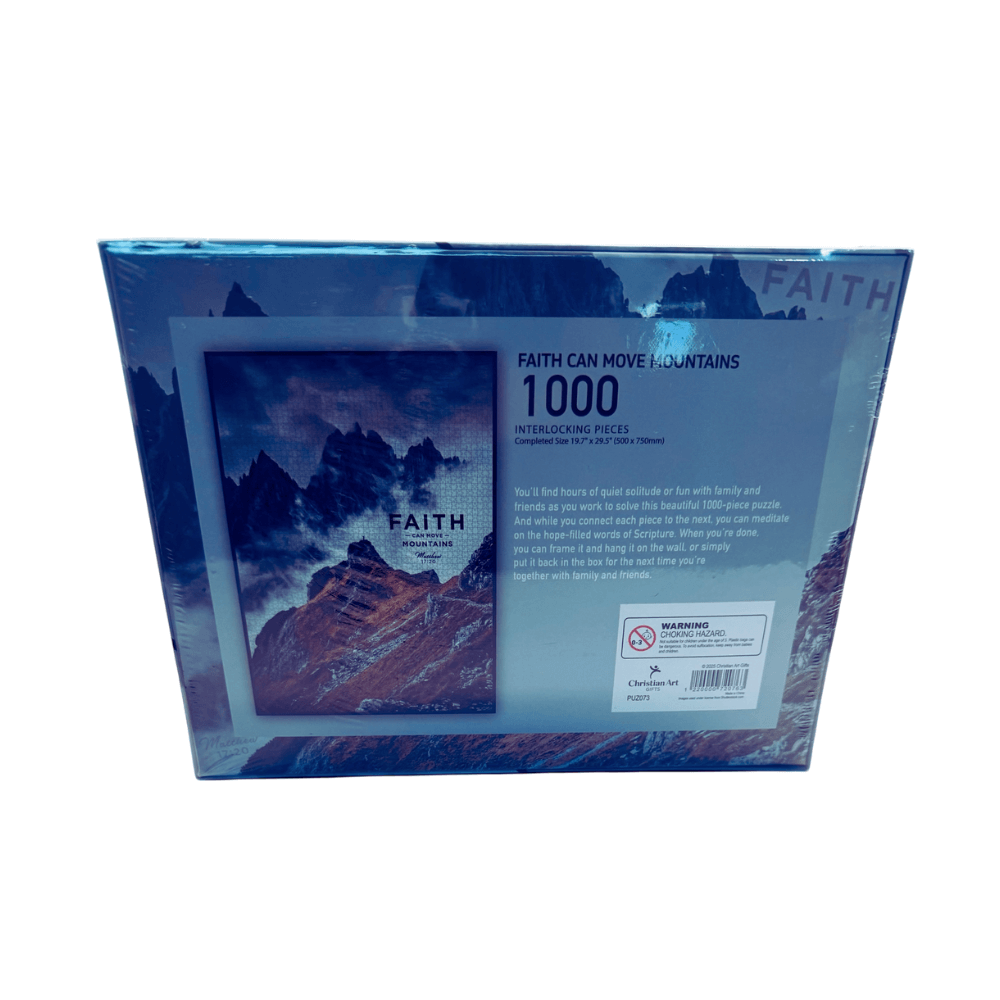 Jigsaw puzzle box with mountain design and 'Faith' text on a white background
