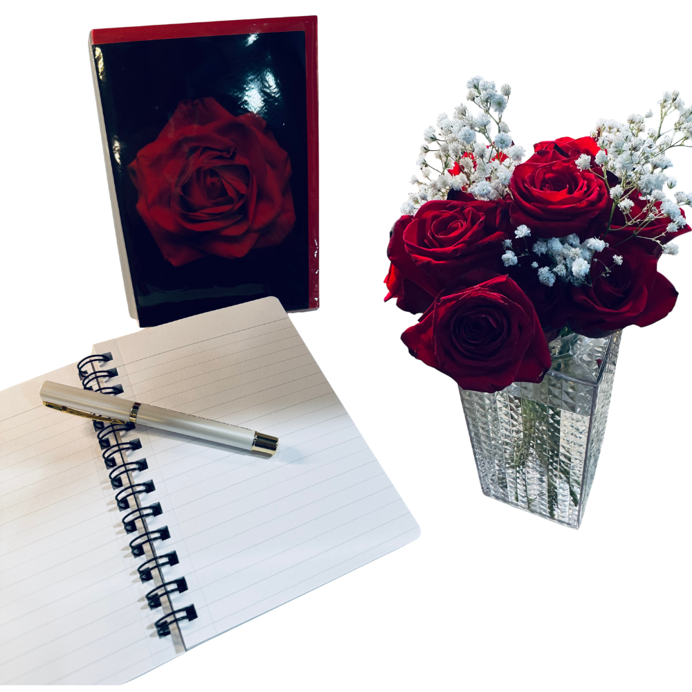 Notebook with pen, box of red rose, and bouquet of red roses and white flowers on a white background