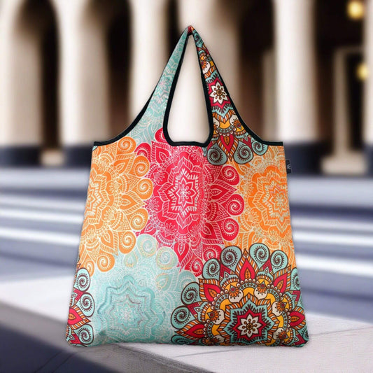 Colorful floral patterned reusable shopping tote bag with vibrant red and orange designs.
