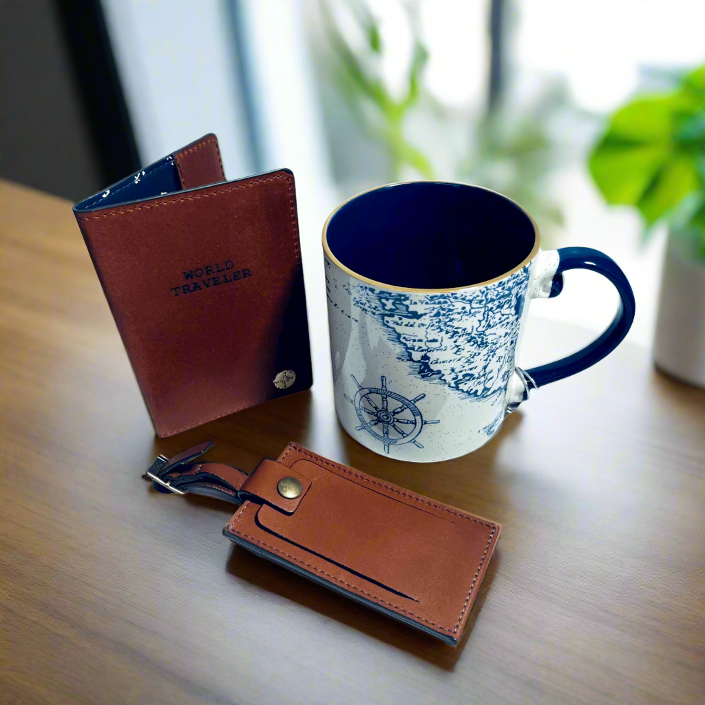 Stylish men's accessories: Nautical-themed coffee mug, leather passport holder, and luggage tag. A versatile gift set for the modern traveler.