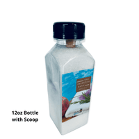 Thumbnail for Tropical scented bath and body gift set in a 12oz bottle with scoop, showcasing a picturesque beach and palm tree scene on the label for Essentialgifting.