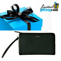 Thumbnail for Sleek black wristlet wallet with double zipper, resting atop a teal gift box with a decorative bow.